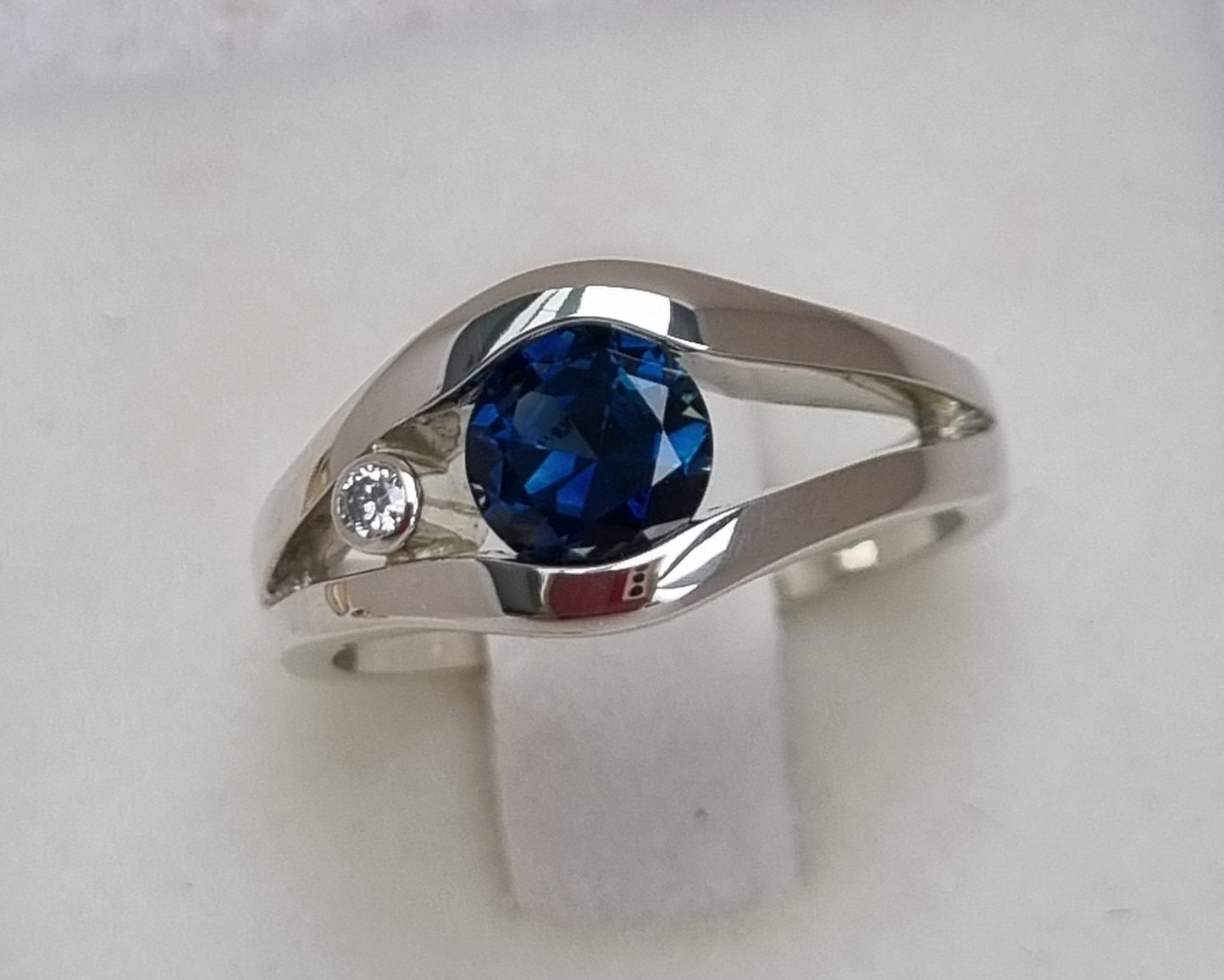 Fine Blue 'Scrub Lead' Sapphire in White Gold Tension Set Ring Design Ref: EBS466-2