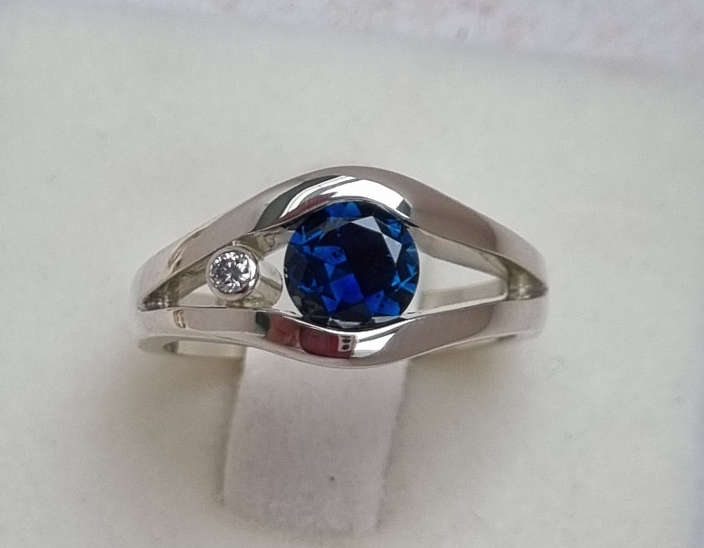 Fine Blue 'Scrub Lead' Sapphire in White Gold Tension Set Ring Design Ref: EBS466-2