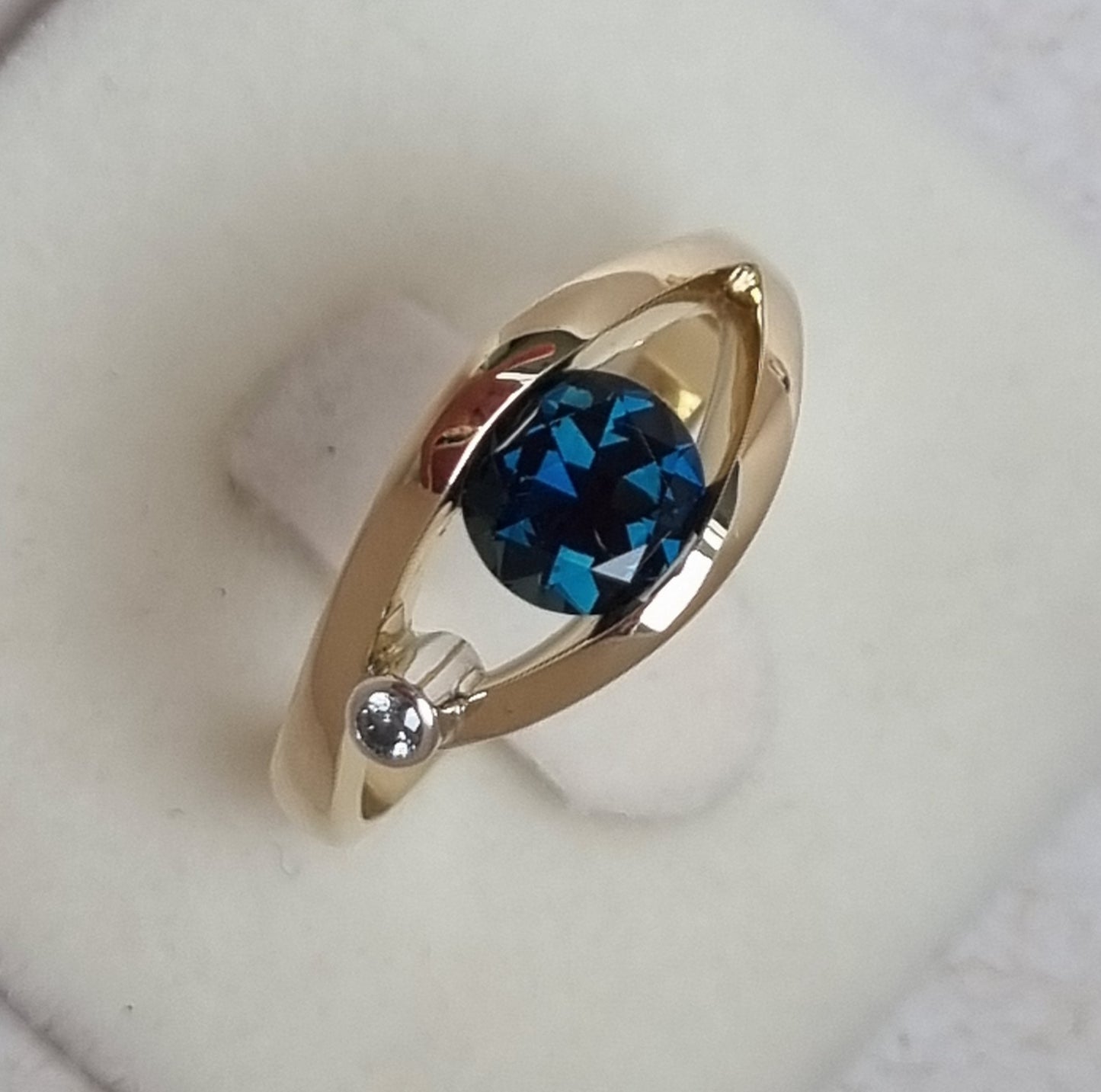 Teal Blue Sapphire in Yellow Gold Tension Design Ring Design Ref: EBS466-4