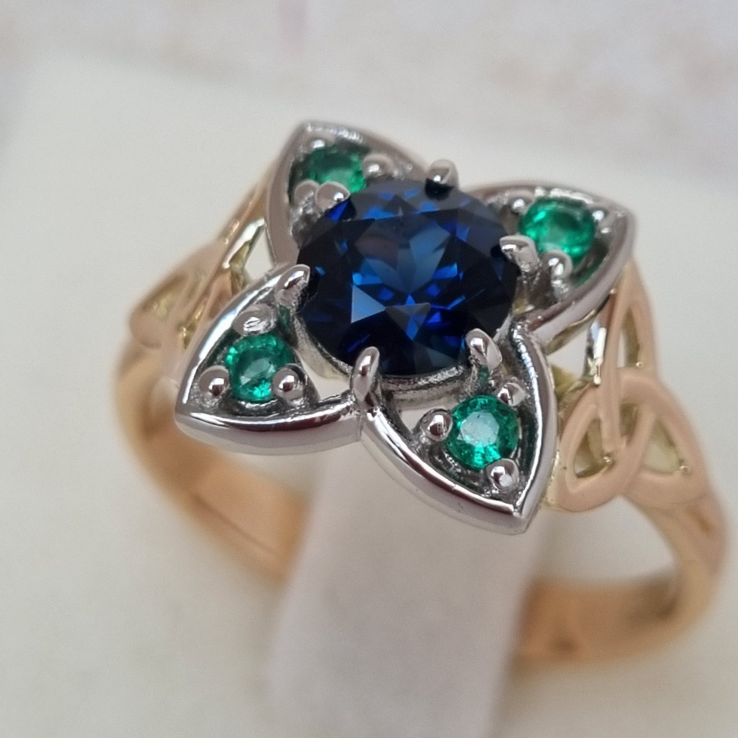 Celtic Triquetra design Blue Sapphire and Emerald ring Design Ref: #01682