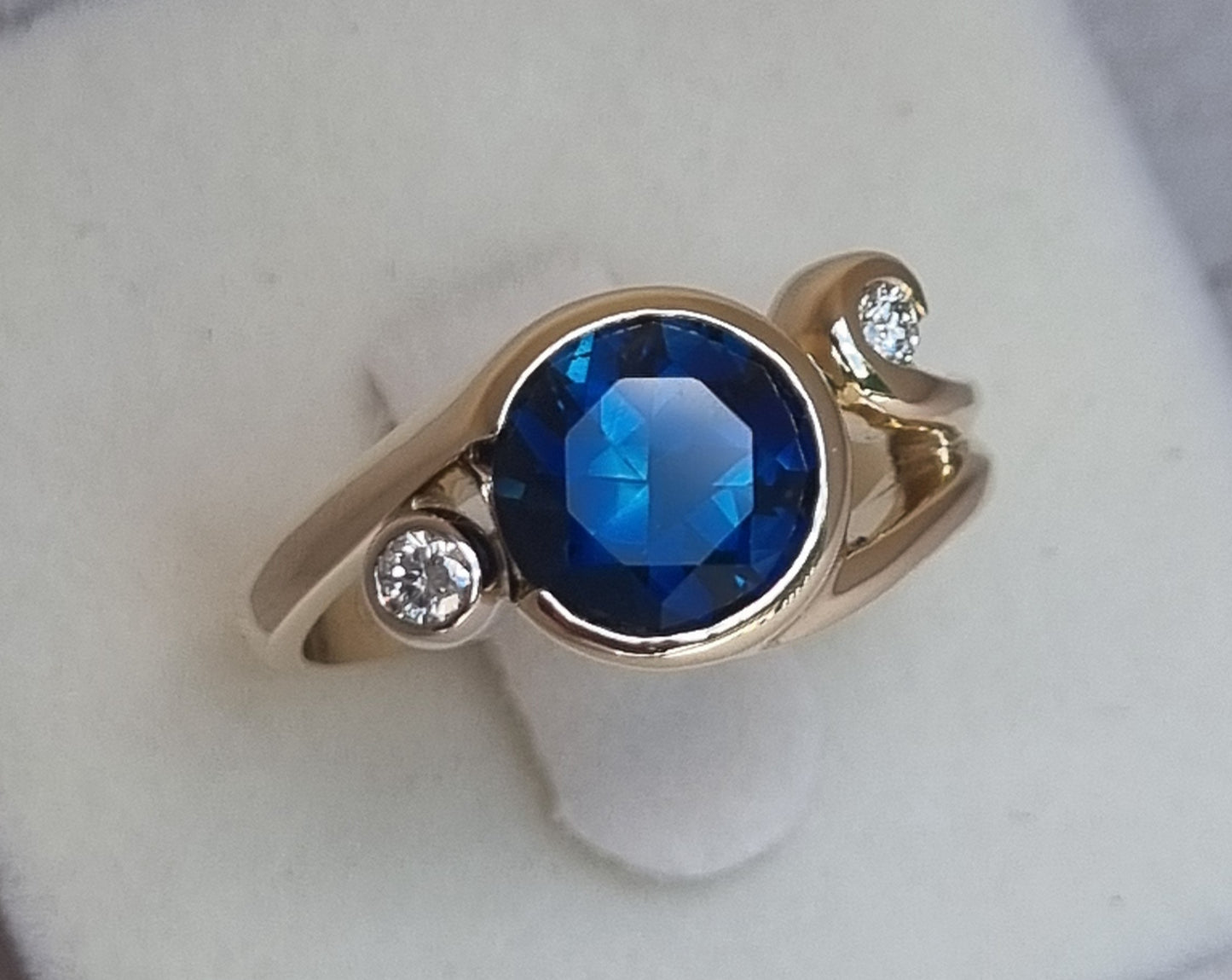 Gold Curls Design Ring with Blue Sapphire and Diamonds Design Ref: EBS467-6