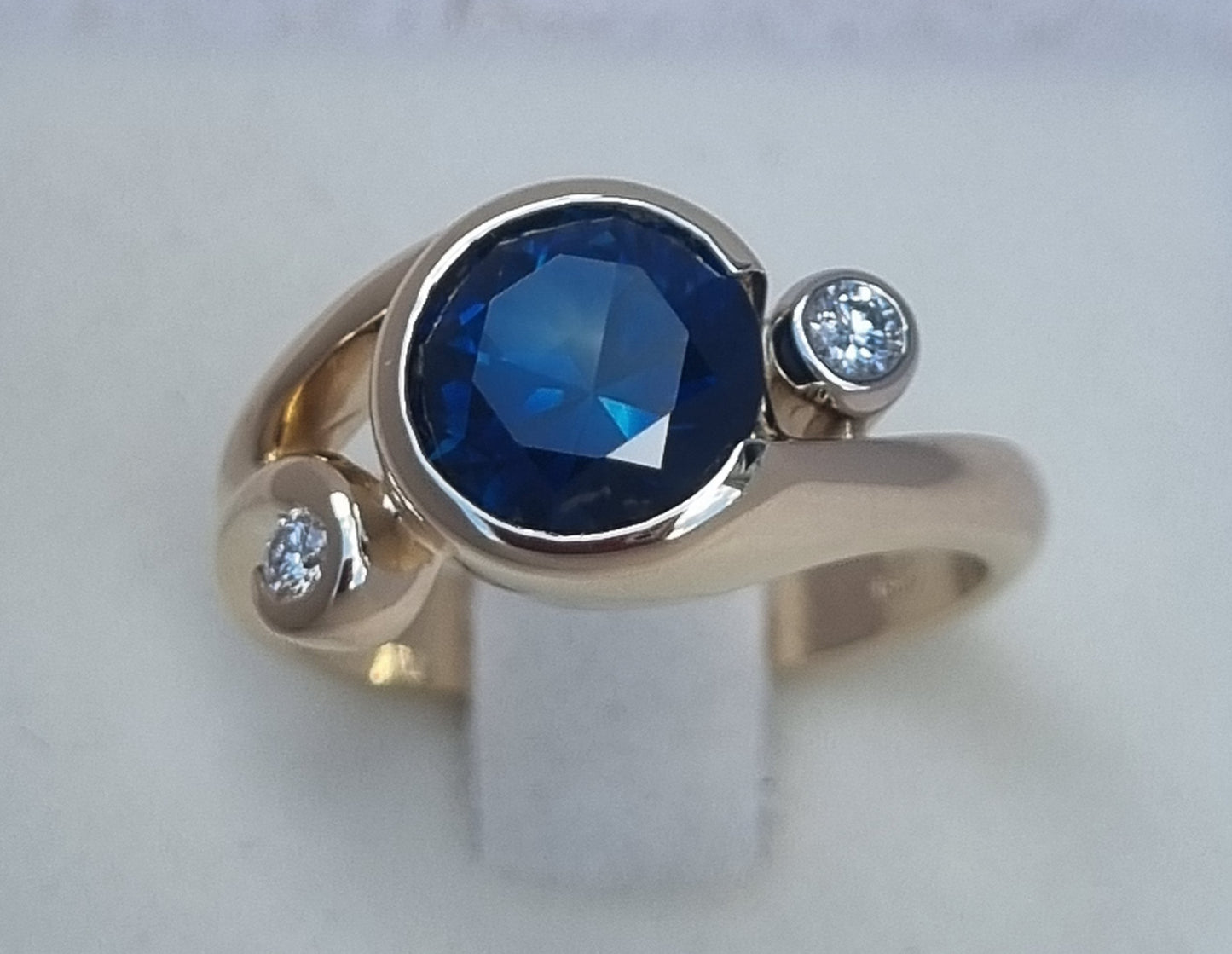 Gold Curls Design Ring with Blue Sapphire and Diamonds Design Ref: EBS467-6