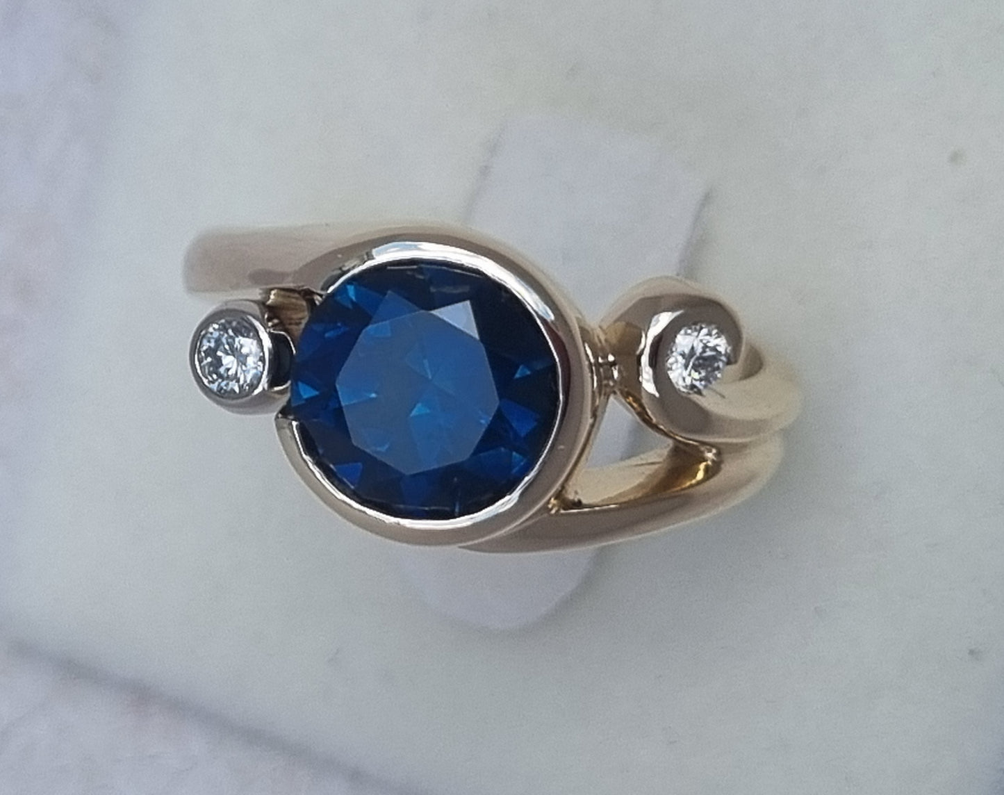 Gold Curls Design Ring with Blue Sapphire and Diamonds Design Ref: EBS467-6