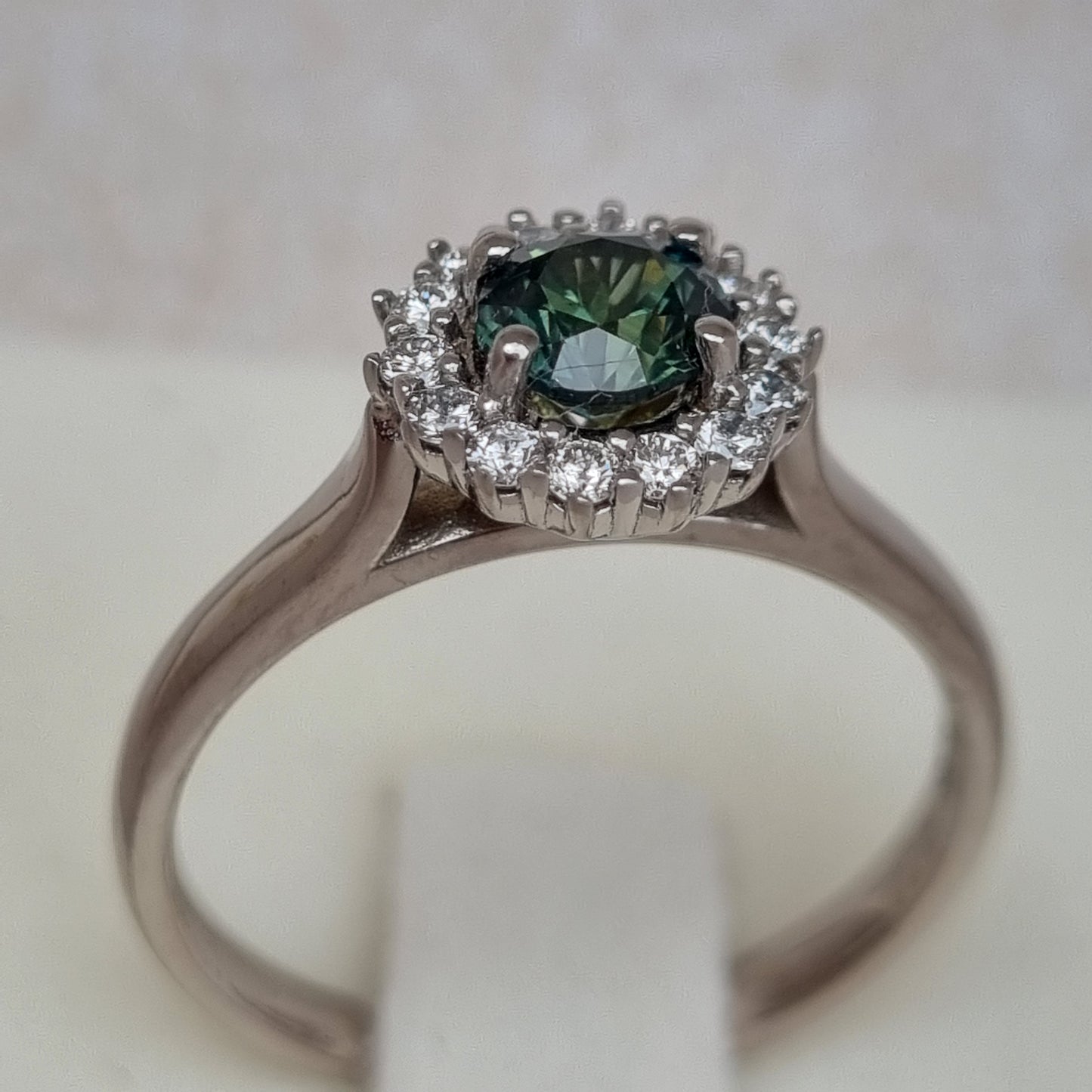 Dark Green Sapphire and Diamond Classic claw set Halo design White Gold ring Design Ref: D359