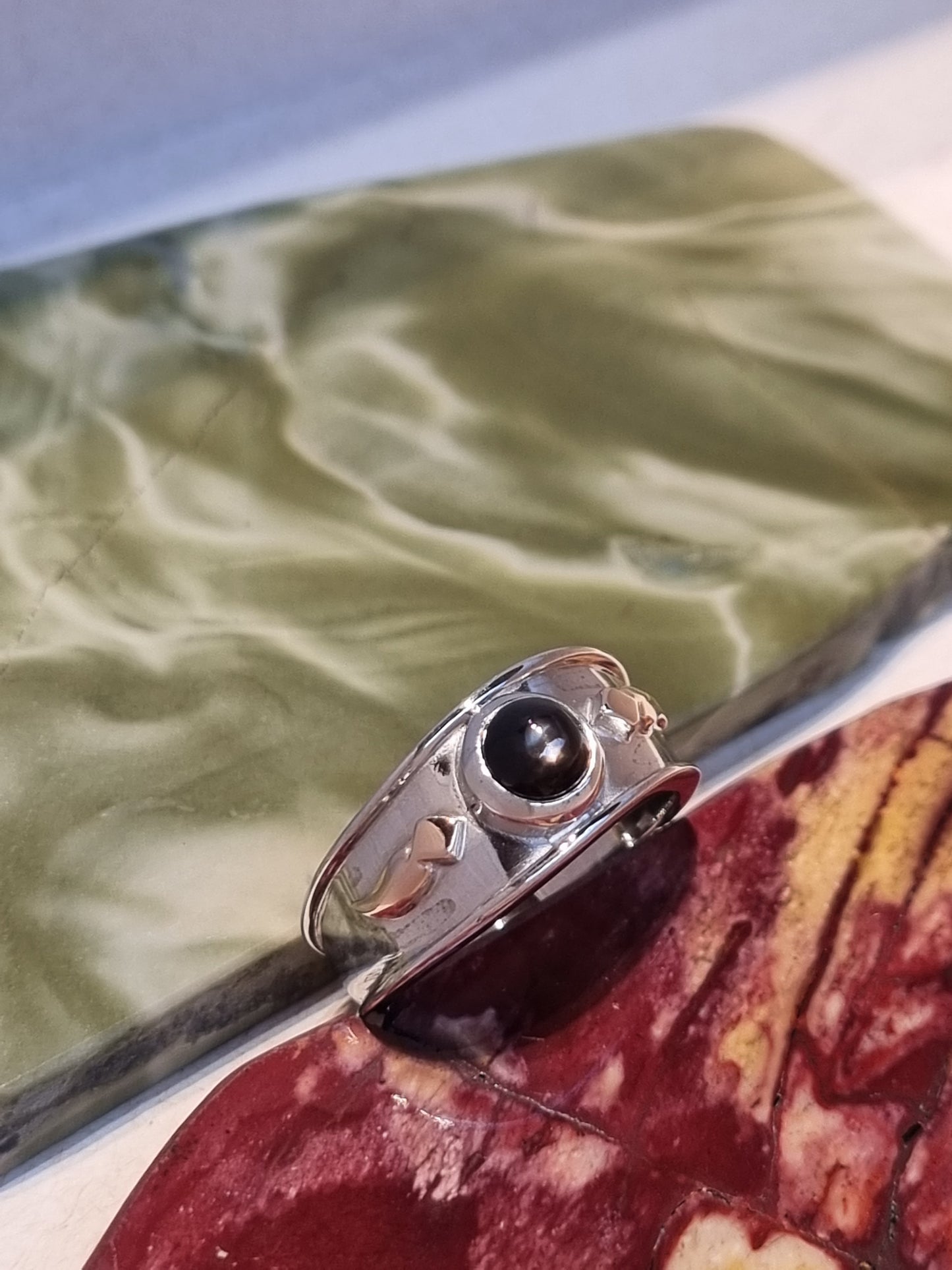 Solitaire Natural Black Star Sapphire Ring with Rose Gold accents
