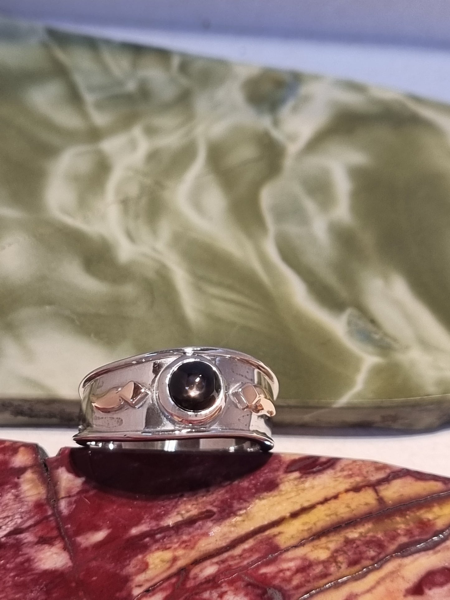 Solitaire Natural Black Star Sapphire Ring with Rose Gold accents