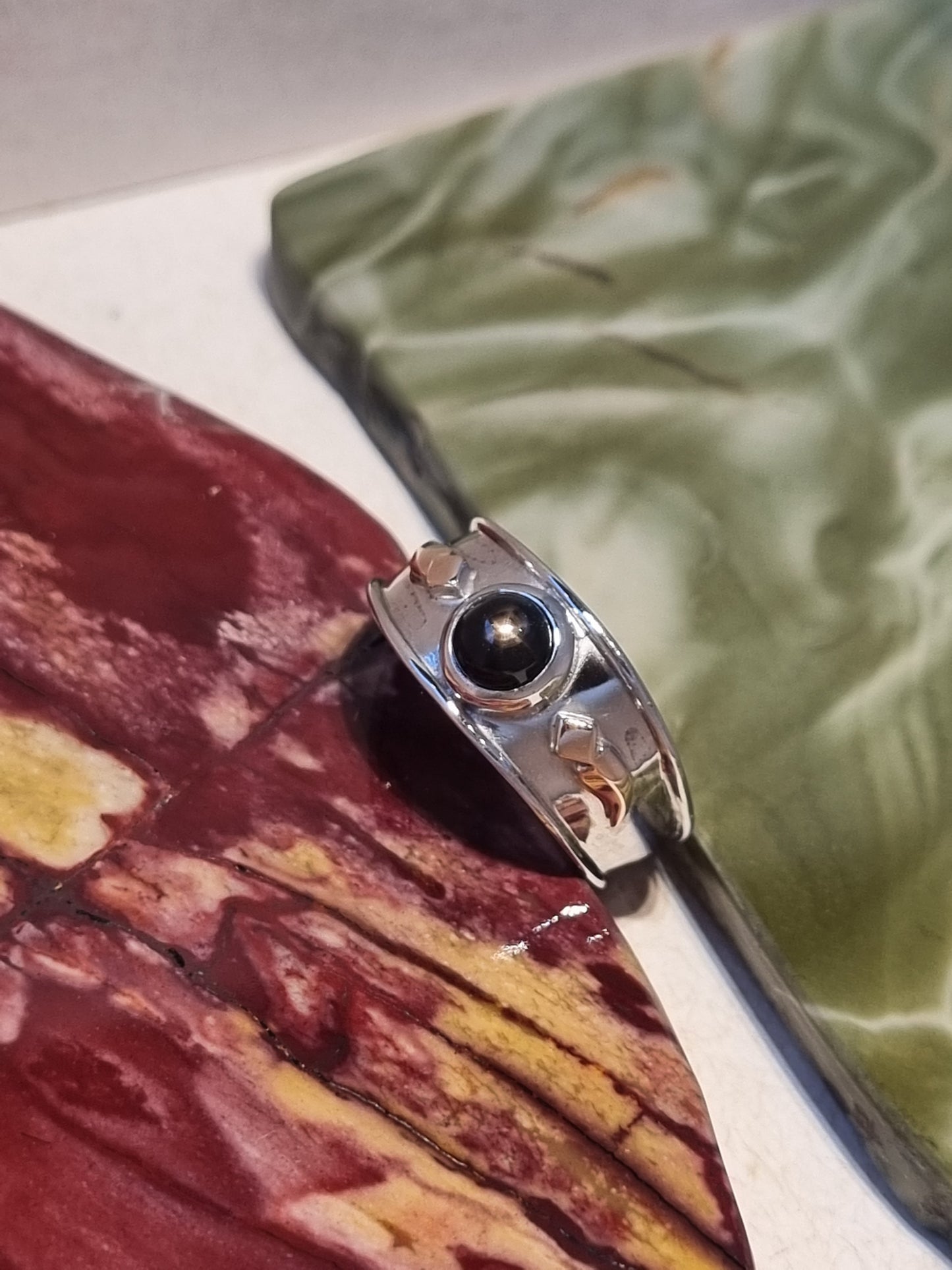 Solitaire Natural Black Star Sapphire Ring with Rose Gold accents