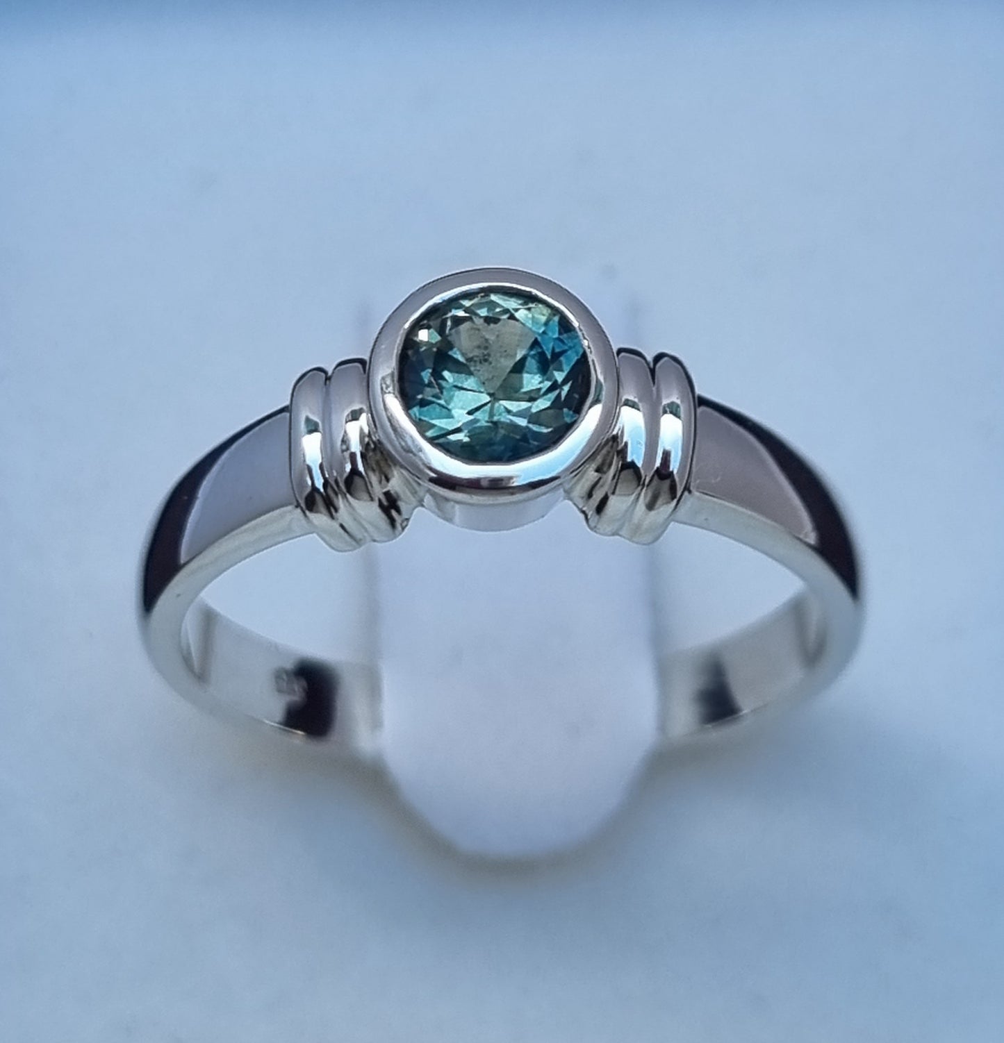 Bezel set Solitaire Aqua Blue Sapphire Ring