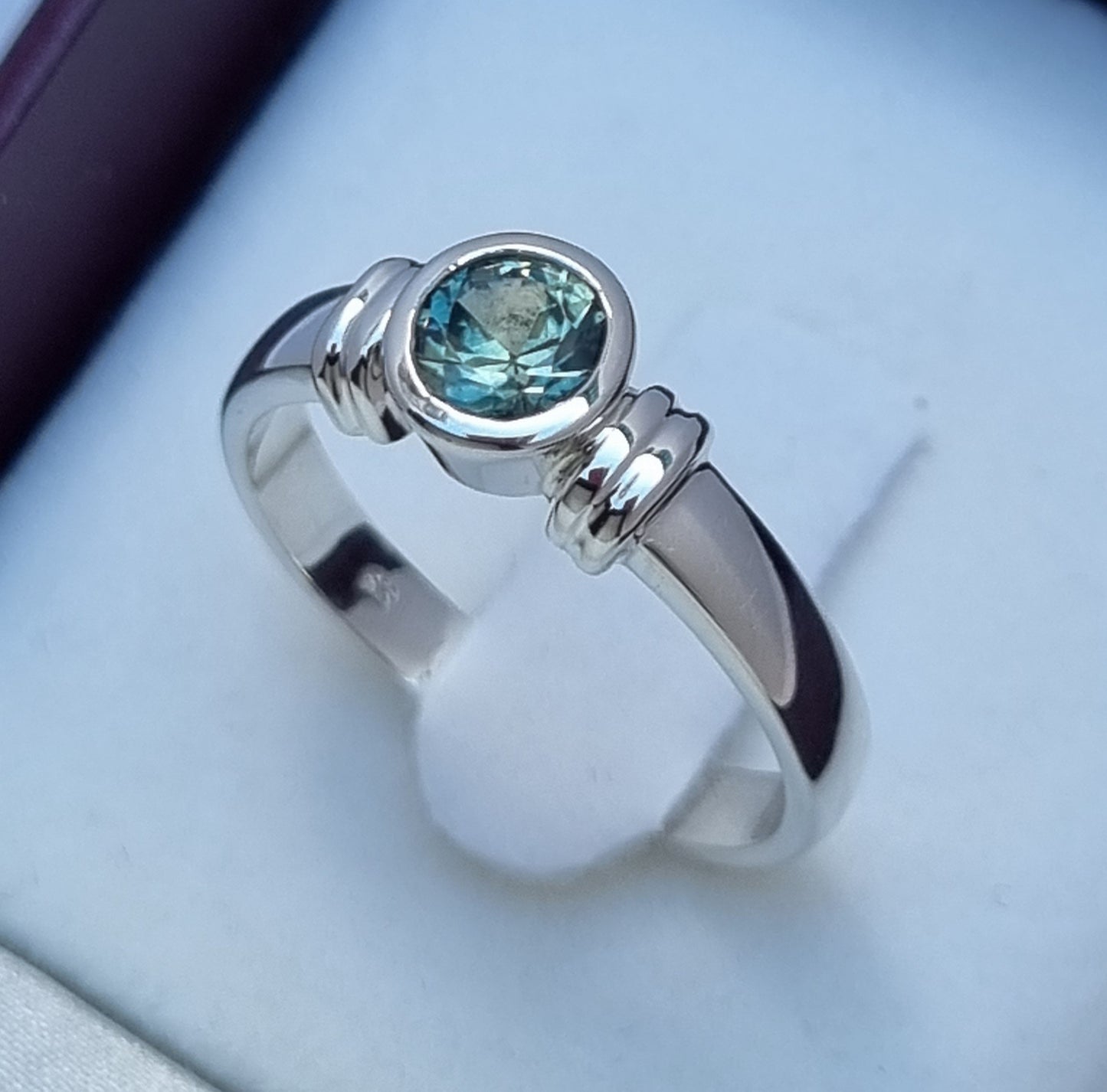 Bezel set Solitaire Aqua Blue Sapphire Ring
