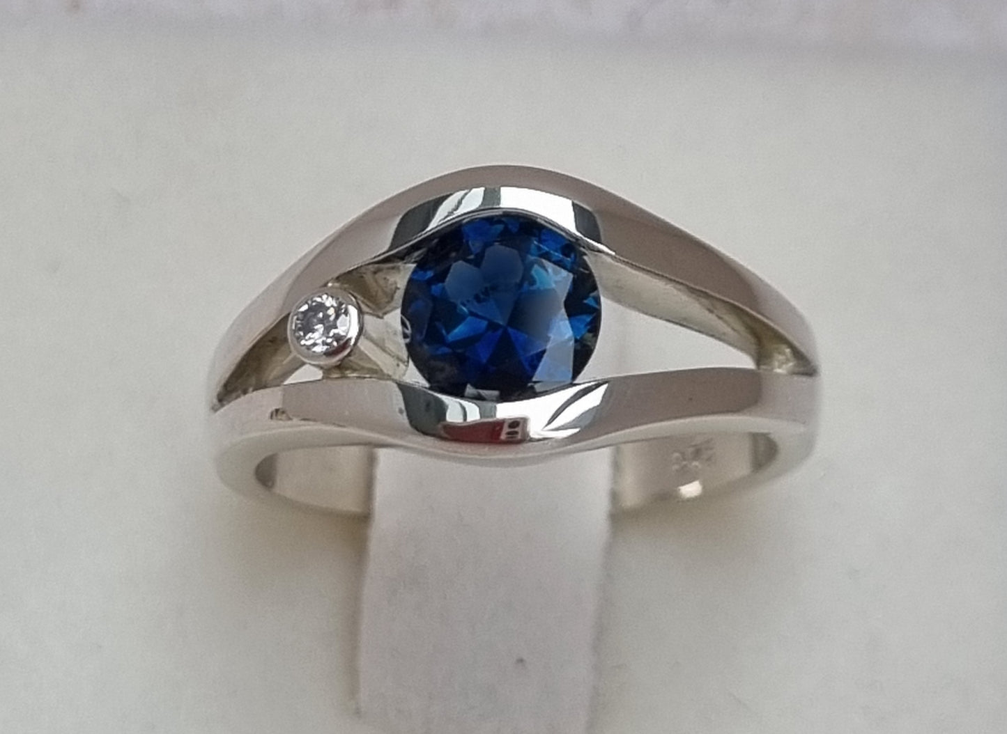 Fine Blue 'Scrub Lead' Sapphire in White Gold Tension Set Ring       Design Ref: EBS466-2