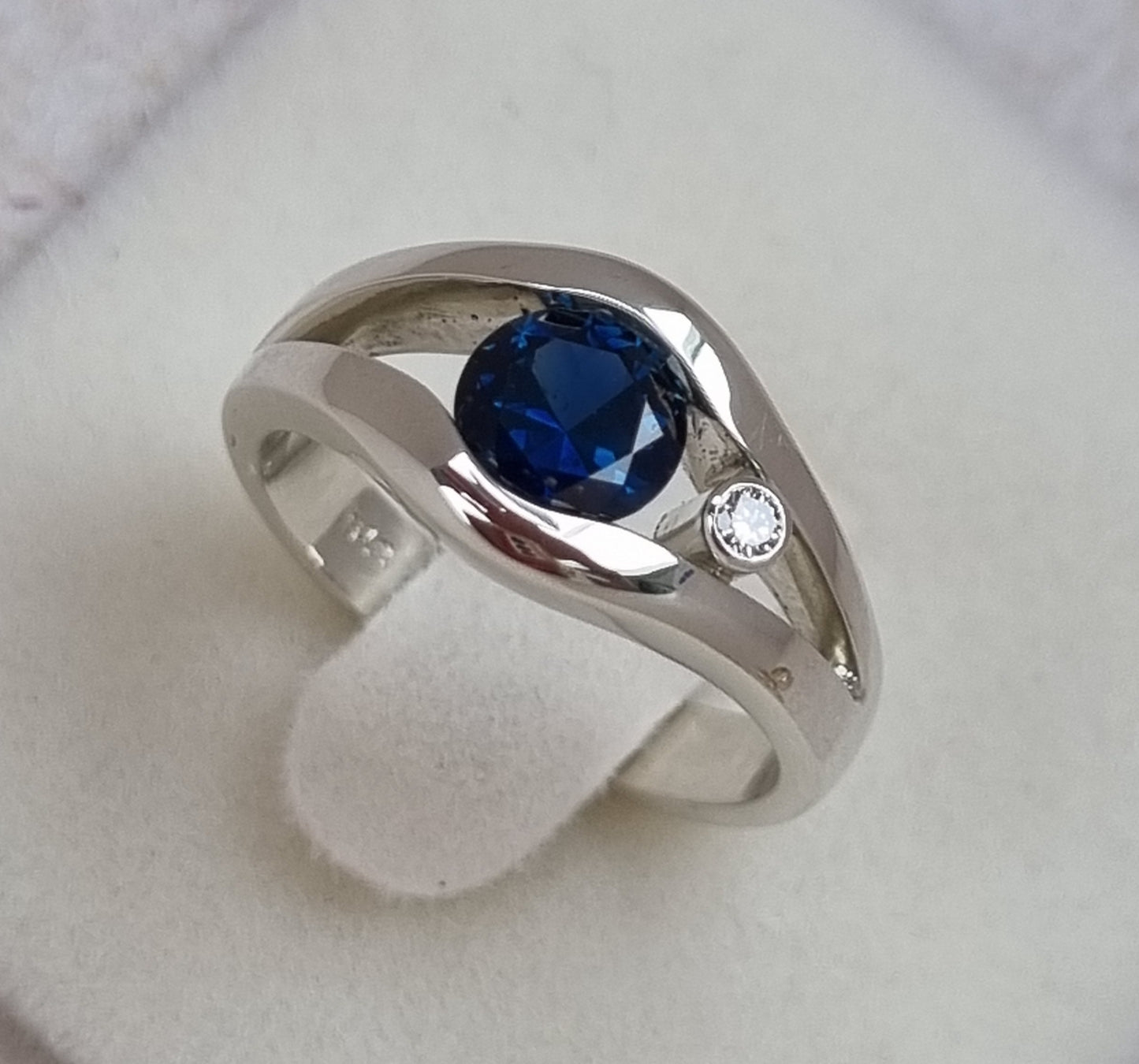 Fine Blue 'Scrub Lead' Sapphire in White Gold Tension Set Ring       Design Ref: EBS466-2