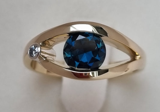 Teal Blue Sapphire in Yellow Gold Tension Design Ring                Design Ref: EBS466-4