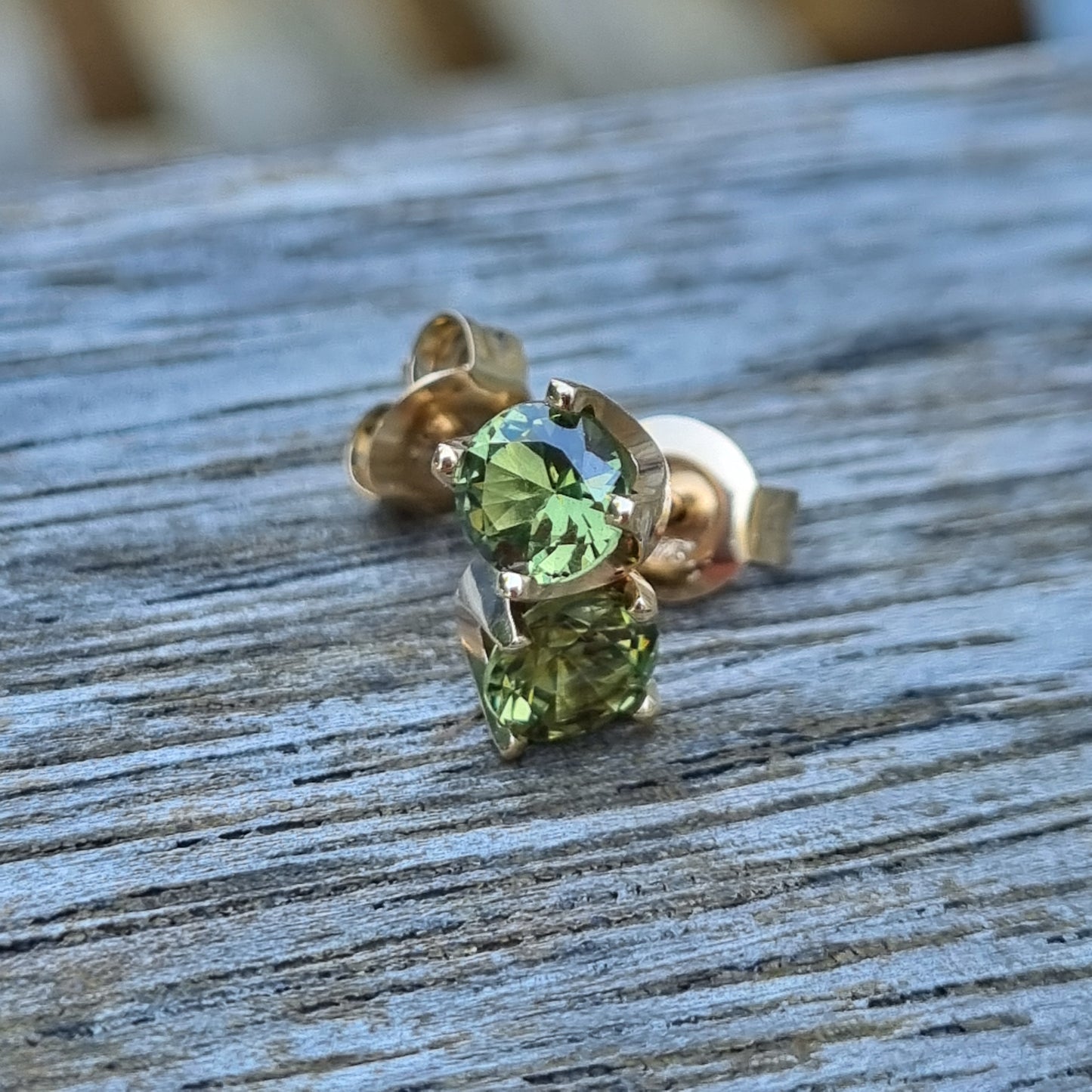 Classic 4 claw style earring studs set with Light Green Sapphires in 9ct Yellow Gold