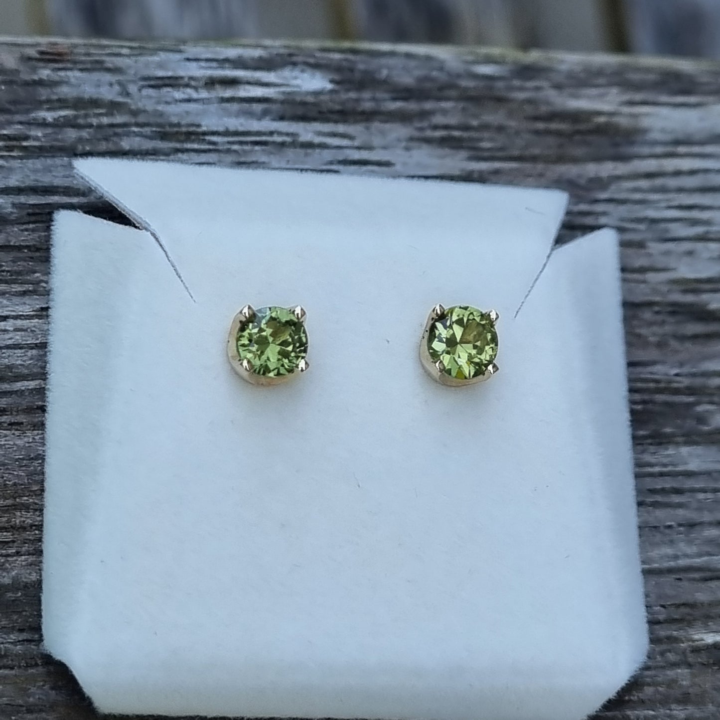 Classic 4 claw style earring studs set with Light Green Sapphires in 9ct Yellow Gold