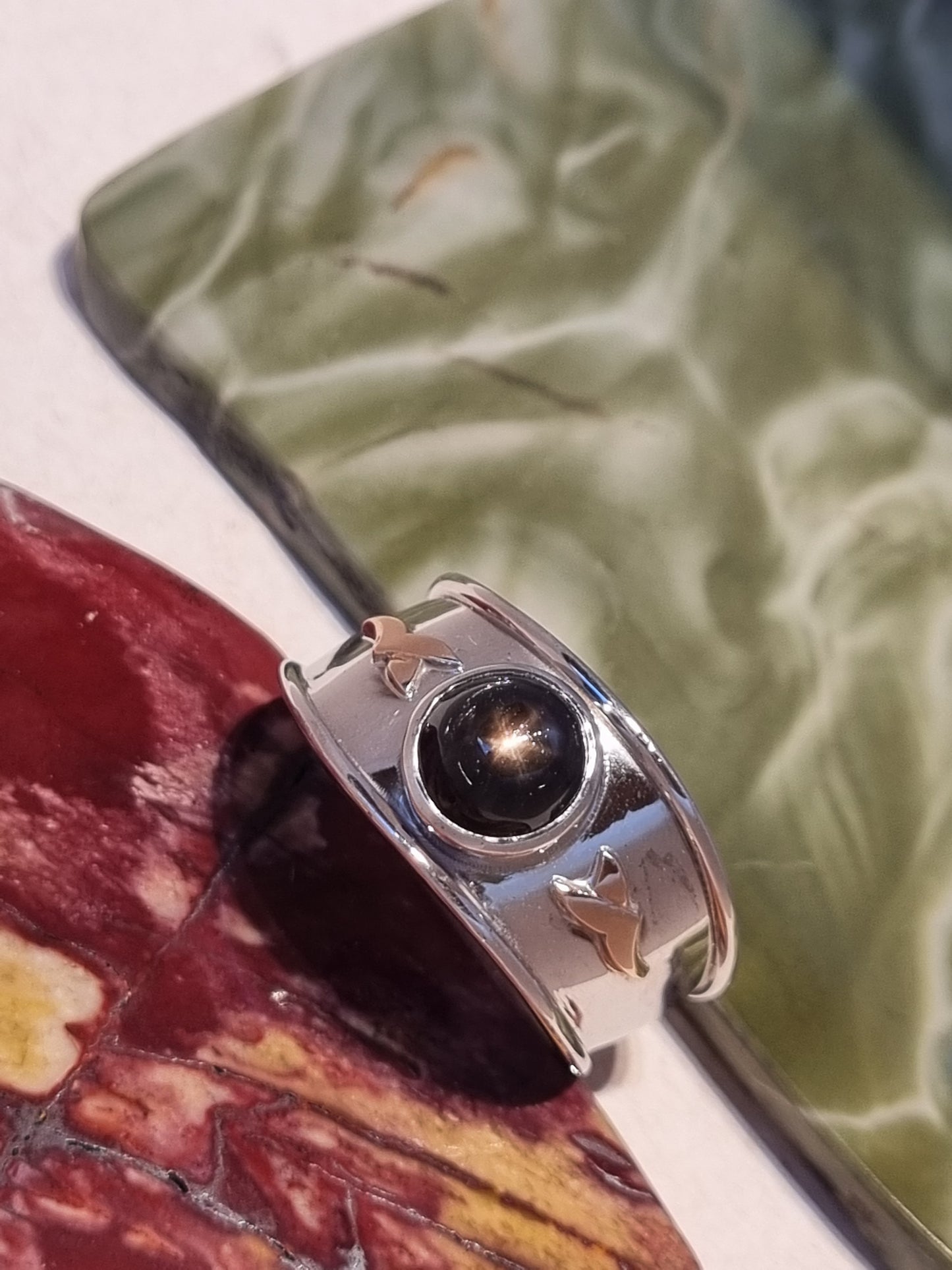 Solitaire Natural Black Star Sapphire Ring with Rose Gold accents