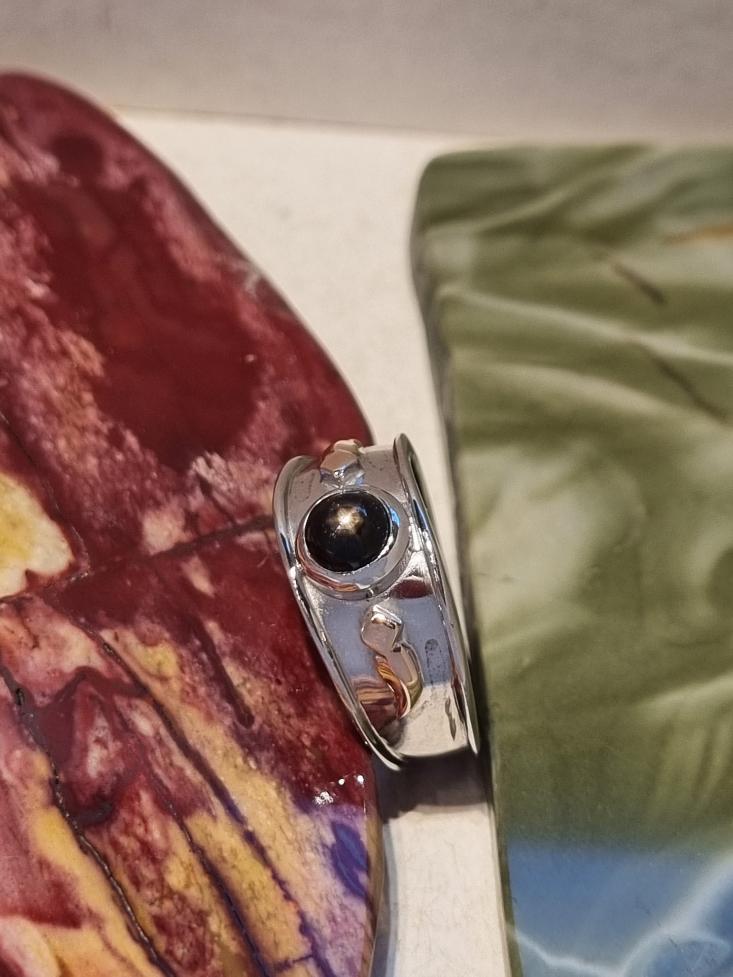 Solitaire Natural Black Star Sapphire Ring with Rose Gold accents